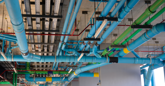 Open system water mains and drainage under ceiling of building